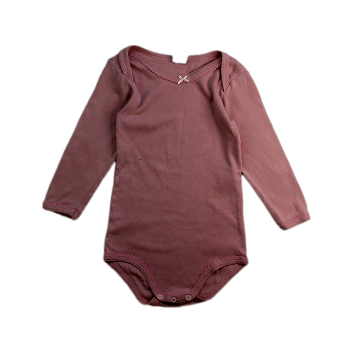 A Pink Long Sleeve Bodysuits from Petit Bateau in size 12-18M for girl. (Front View)
