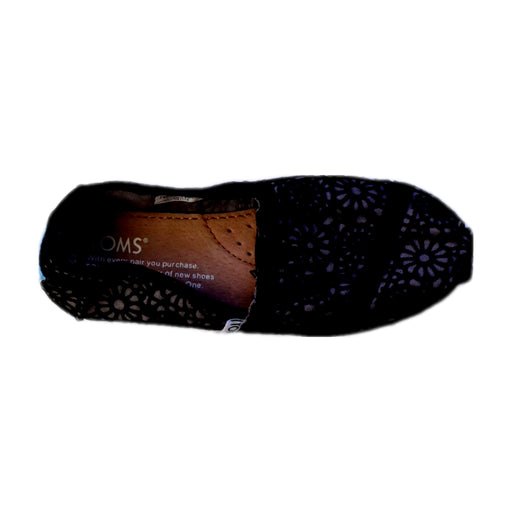 A Black Slip Ons from Toms in size 6T for girl. (Front View)