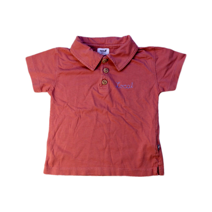 A Peach Short Sleeve Polos from Oeuf in size 2T for boy. (Front View)