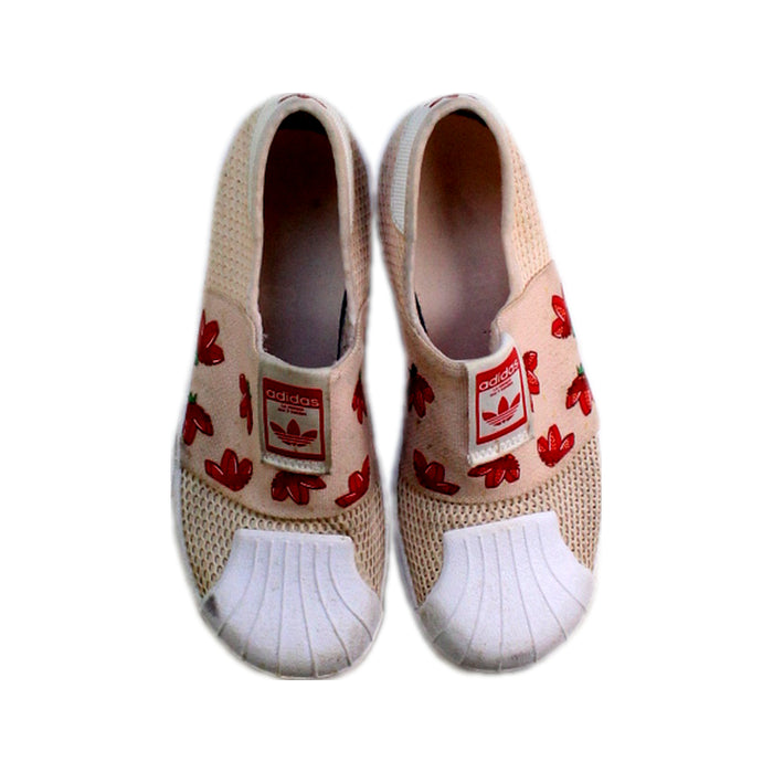 A White Slip Ons from Adidas in size 9Y for girl. (Back View)
