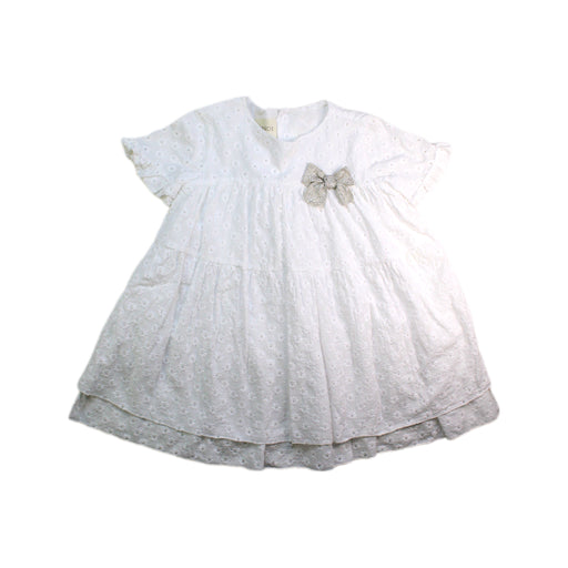 A White Short Sleeve Dresses from Nanos in size 4T for girl. (Front View)