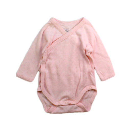 A Pink Long Sleeve Bodysuits from Petit Bateau in size Newborn for girl. (Front View)