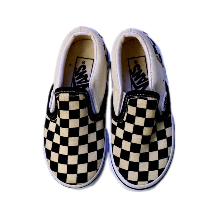 A Black Slip Ons from Vans in size 3T for neutral. (Back View)