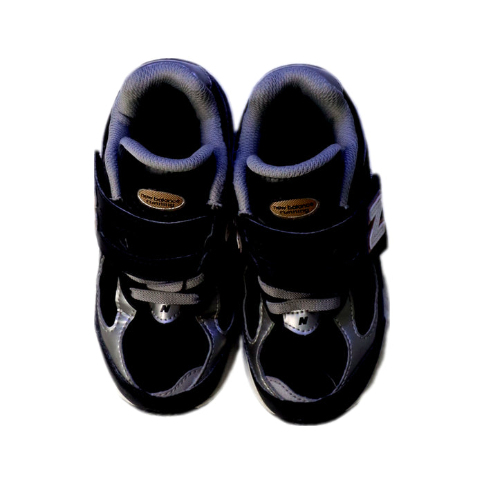 A Black Sneakers from New Balance in size 5T for neutral. (Back View)
