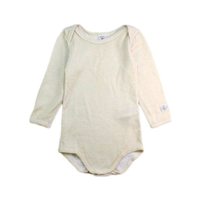 A Ivory Long Sleeve Bodysuits from Petit Bateau in size 12-18M for neutral. (Front View)
