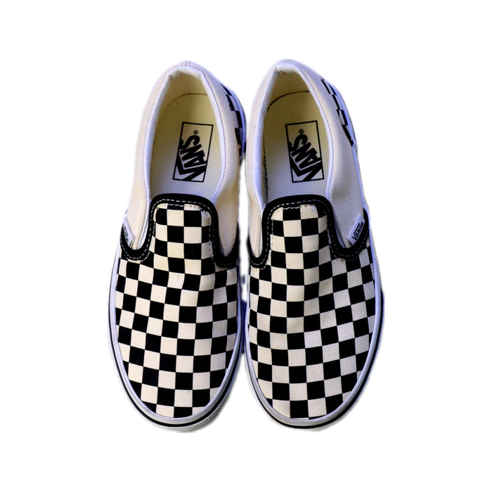 A Black Slip Ons from Vans in size 7Y for neutral. (Back View)