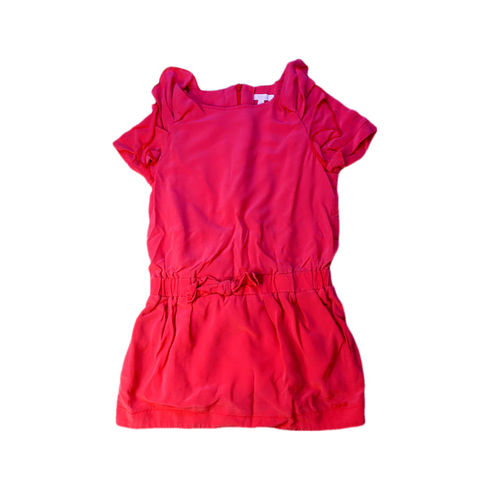 A Pink Short Sleeve Dresses from Chloe in size 4T for girl. (Front View)