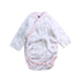 A White Long Sleeve Bodysuits from Cambrass in size 0-3M for girl. (Front View)