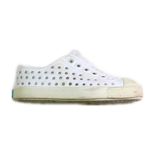 A White Slip Ons from Native Shoes in size 12-18M for neutral. (Front View)