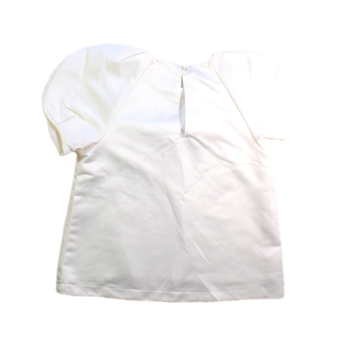 A White Short Sleeve Tops from Seed in size 6T for girl. (Back View)