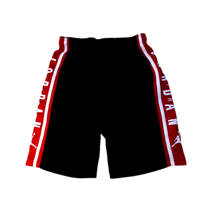 A Black Shorts from Air Jordan in size 14Y for boy. (Front View)