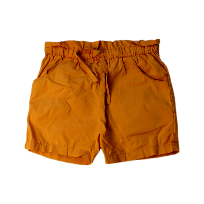 A Orange Shorts from Nature Baby in size 3T for girl. (Front View)