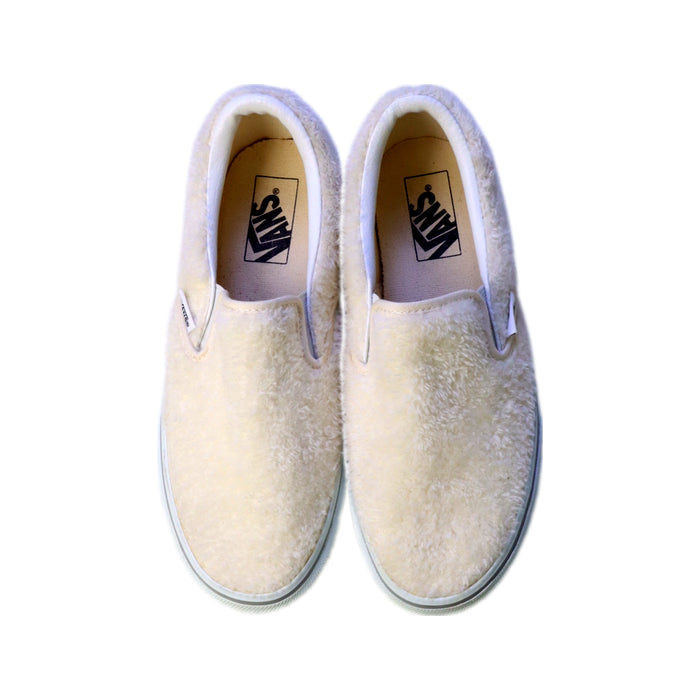 A White Slip Ons from Vans in size 12Y for girl. (Back View)