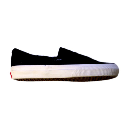 A Black Slip Ons from Vans in size 12Y for girl. (Front View)