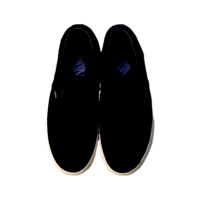 A Black Slip Ons from Vans in size 12Y for girl. (Back View)
