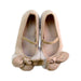 A Ivory Flats from Charabia in size 5T for girl. (Back View)