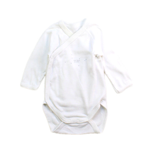 A White Long Sleeve Bodysuits from Petit Bateau in size Newborn for boy. (Front View)