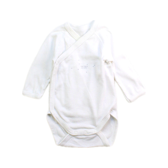 A White Long Sleeve Bodysuits from Petit Bateau in size Newborn for boy. (Front View)