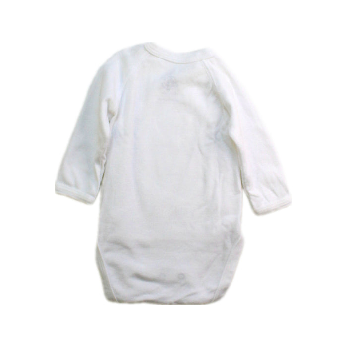 A White Long Sleeve Bodysuits from Petit Bateau in size Newborn for boy. (Back View)