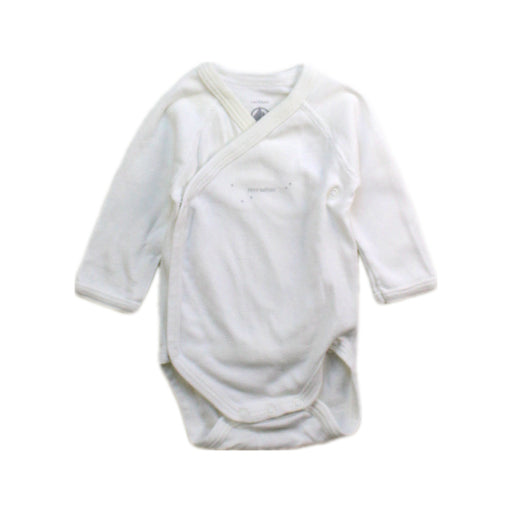 A White Long Sleeve Bodysuits from Petit Bateau in size Newborn for boy. (Front View)