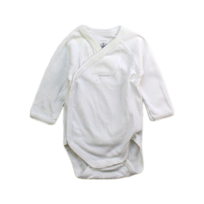 A White Long Sleeve Bodysuits from Petit Bateau in size Newborn for boy. (Front View)