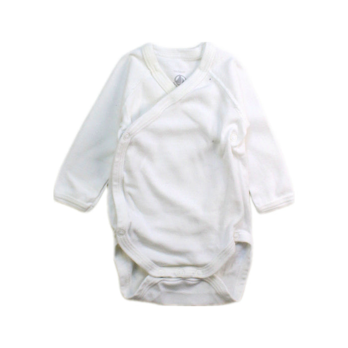 A White Long Sleeve Bodysuits from Petit Bateau in size Newborn for neutral. (Front View)