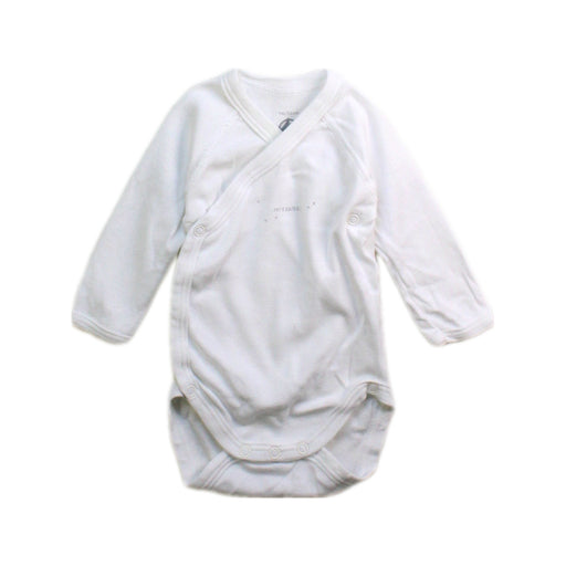 A White Long Sleeve Bodysuits from Petit Bateau in size Newborn for boy. (Front View)
