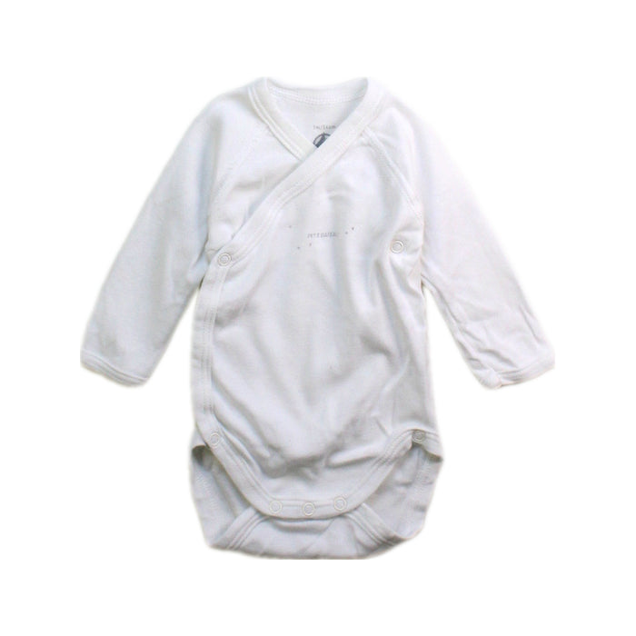 A White Long Sleeve Bodysuits from Petit Bateau in size Newborn for boy. (Front View)