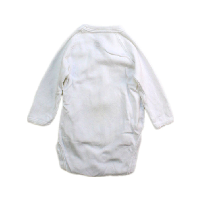 A White Long Sleeve Bodysuits from Petit Bateau in size Newborn for boy. (Back View)