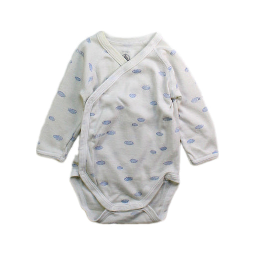 A White Long Sleeve Bodysuits from Petit Bateau in size Newborn for boy. (Front View)