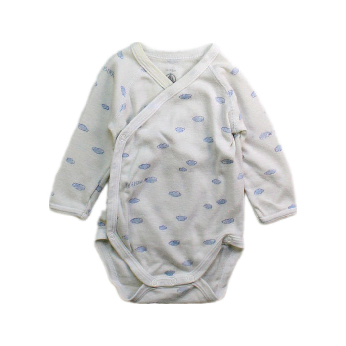 A White Long Sleeve Bodysuits from Petit Bateau in size Newborn for boy. (Front View)