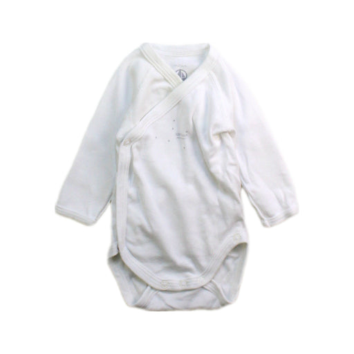 A White Long Sleeve Bodysuits from Petit Bateau in size Newborn for boy. (Front View)