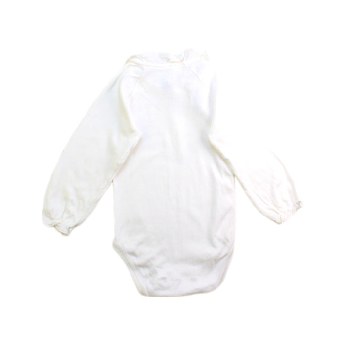 A Ivory Long Sleeve Bodysuits from Petit Bateau in size 6-12M for girl. (Back View)
