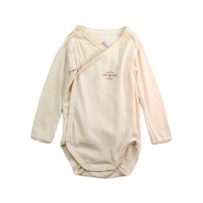 A Ivory Long Sleeve Bodysuits from Petit Bateau in size 6-12M for neutral. (Front View)