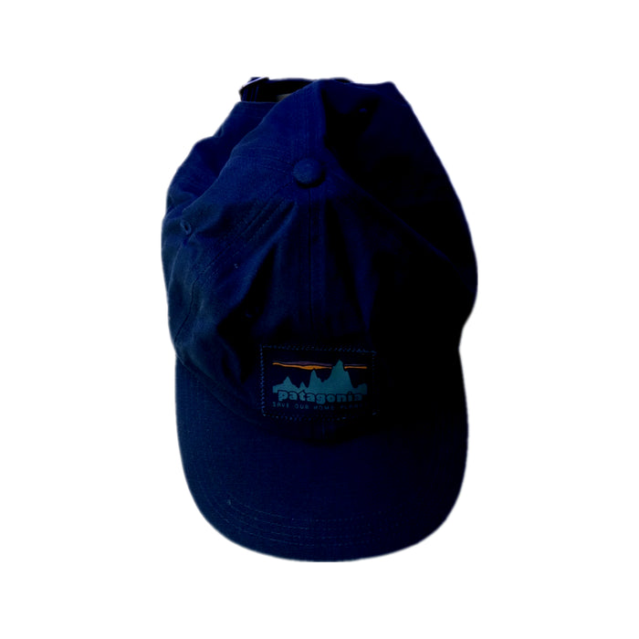 A Navy Caps from Patagonia in size 14Y for neutral. (Back View)