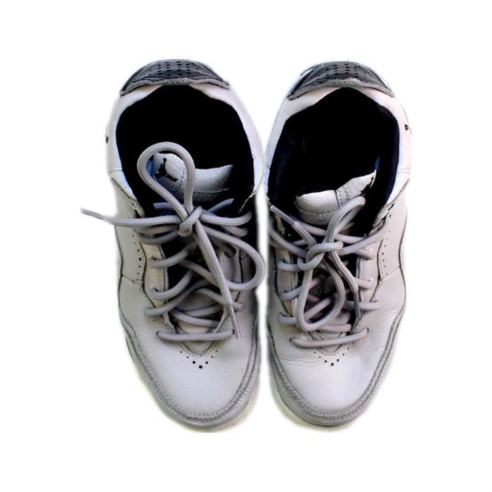 A Grey Sneakers from Air Jordan in size 11Y for boy. (Back View)