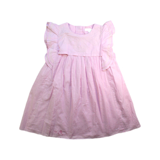 A Pink Sleeveless Dresses from Chloe in size 5T for girl. (Front View)