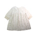 A Ivory Long Sleeve Dresses from Nanos in size 6T for girl. (Back View)