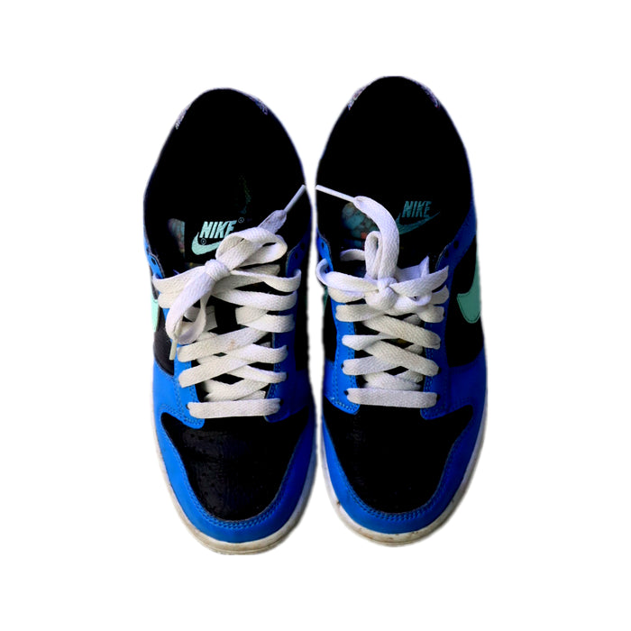 A Blue Sneakers from Nike in size 11Y for boy. (Back View)
