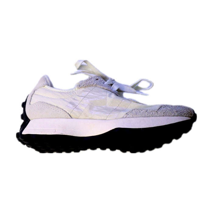 A White Sneakers from New Balance in size 11Y for neutral. (Front View)
