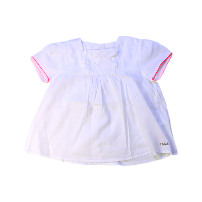 A White Short Sleeve Tops from Chloe in size 6-12M for girl. (Front View)