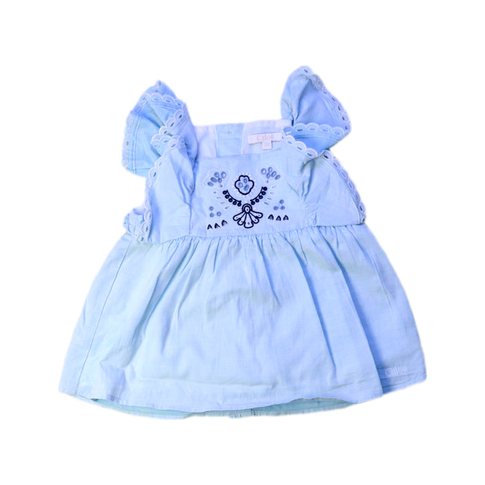 A Blue Sleeveless Dresses from Chloe in size 6-12M for girl. (Front View)