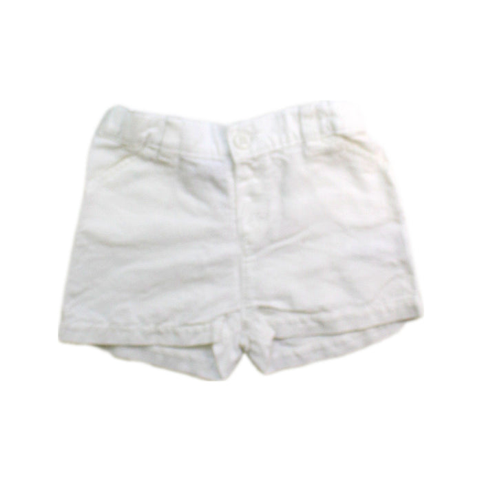 A White Shorts from Petit Bateau in size 6-12M for neutral. (Front View)