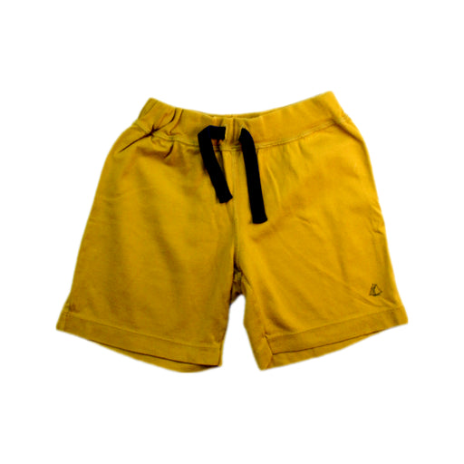 A Yellow Shorts from Petit Bateau in size 4T for boy. (Front View)