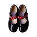 A Black Flats from Clarks in size 5T for girl. (Back View)