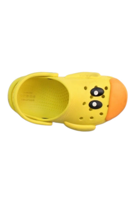 A Yellow Slip Ons from Crocs in size 3T for neutral. (Front View)
