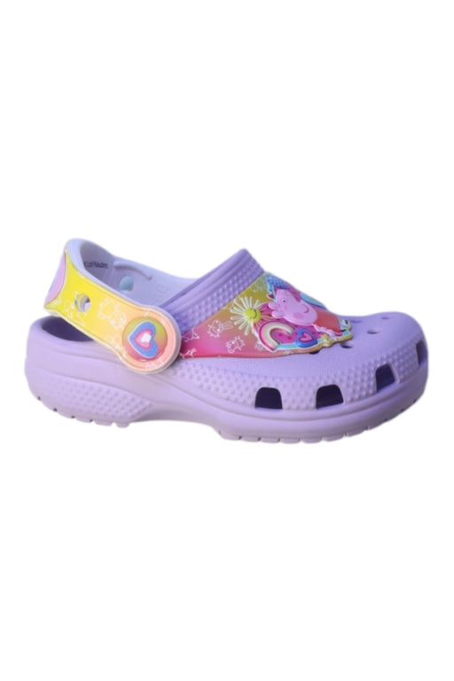 A Pink Slip Ons from Crocs in size 18-24M for girl. (Front View)