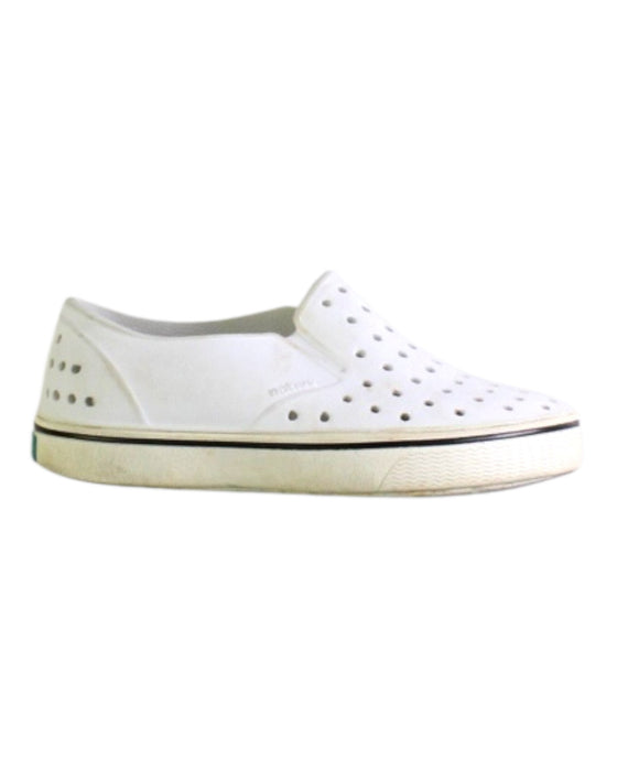 A White Slip Ons from Native Shoes in size 6T for boy. (Front View)
