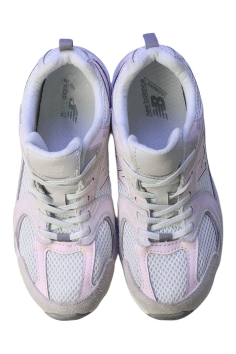 A White Sneakers from New Balance in size 10Y for girl. (Back View)