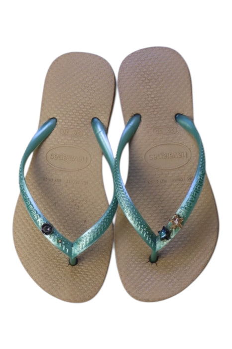A Beige Flip Flops from Havaianas in size 6T for girl. (Back View)
